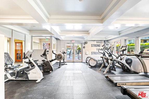 Interior view of a gym area with exercise equipment.