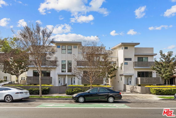 Front view of a modern multi-story residential building