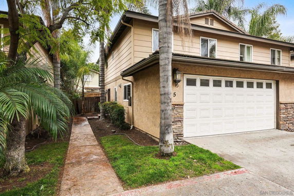 Front view of a two-story house with a double garage.