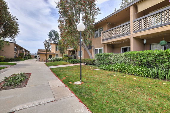 Front view of multi-story residential buildings with balconies.