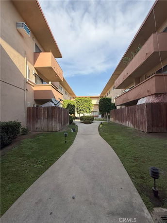 Front view of an apartment building with multiple balconies.