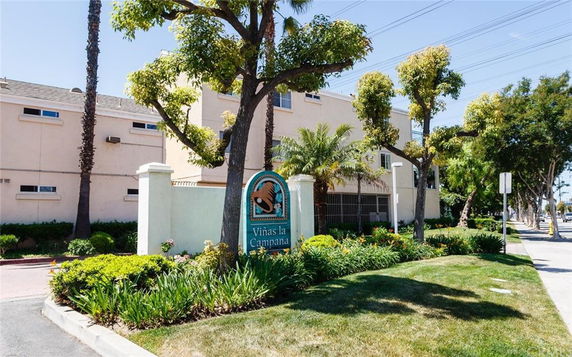 Front view of a multi-story building with a sign indicating the name 'Viñas la Campana'.