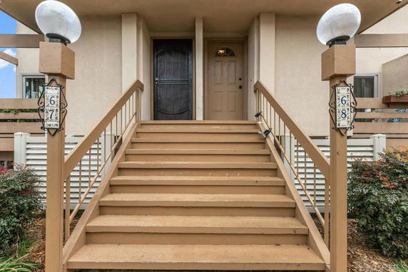 Front view of an entrance with stairs leading to a door.
