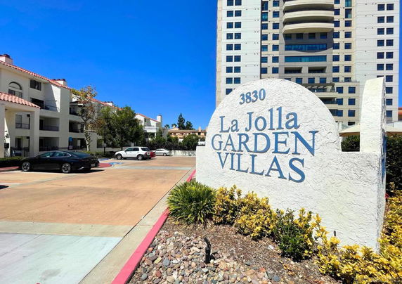 Entrance and parking area of La Jolla Garden Villas.