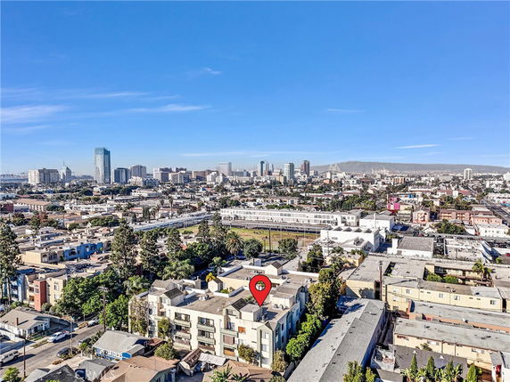 Panoramic view of a cityscape with various buildings and roads.