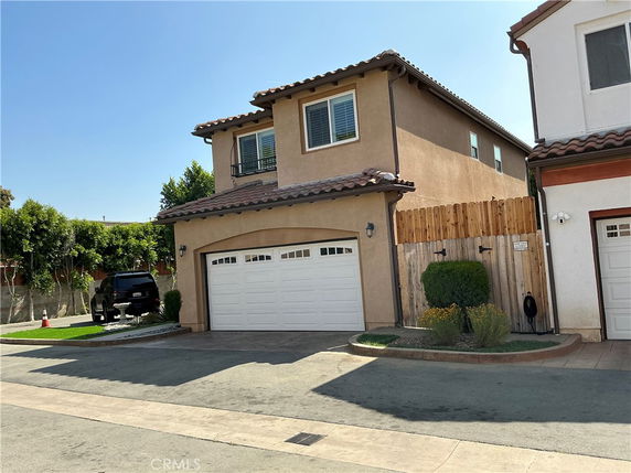 Front view of a two-story house with a double garage.
