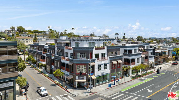 Front view of a multi-story commercial building with modern design.