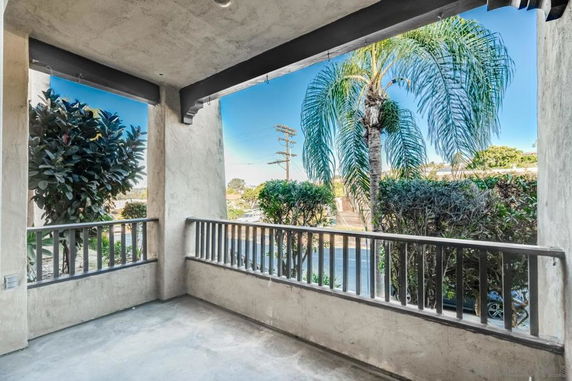 Patio view with surrounding trees and shrubs.