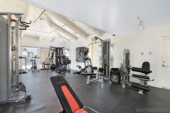 Indoor gym area with various exercise equipment.