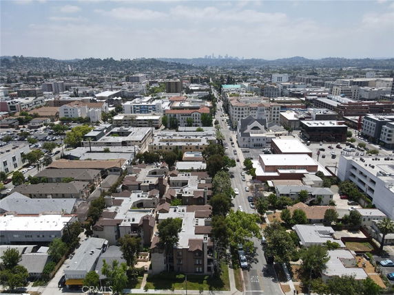 Aerial view of an urban area with residential and commercial buildings.