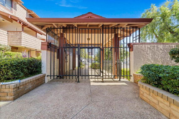 Front view of a gated entrance to a residential building.
