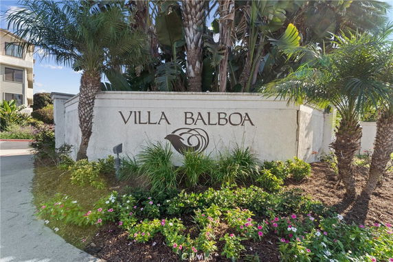 Front view of the entrance to a residential building complex with a sign reading 'Villa Balboa'.