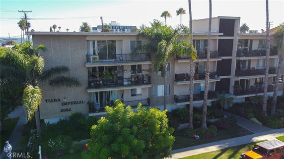 Front view of a multi-story apartment building named Tiara Imperial with balconies.