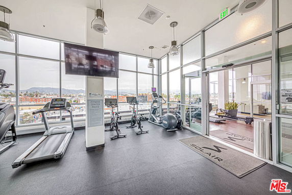 Indoor gym area with treadmills and exercise bikes.