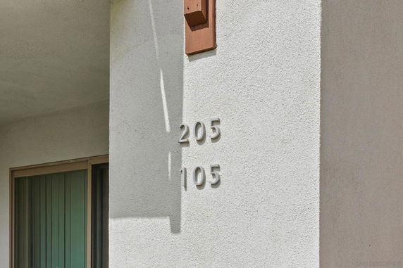 Exterior view showing wall with numbers 205 and 105.