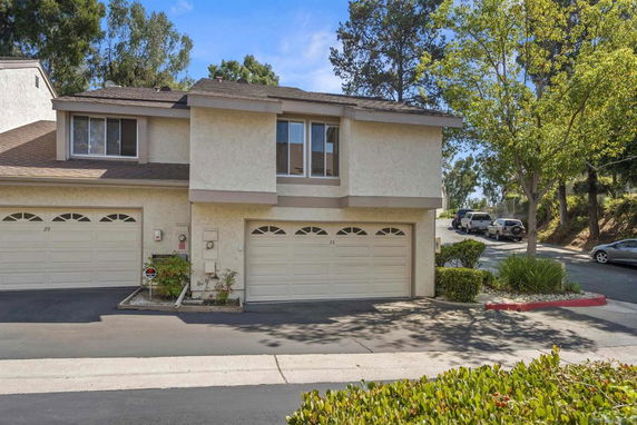 Front view of a two-story house with an attached double garage.