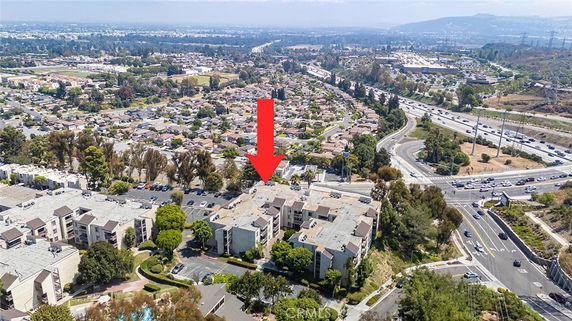 Panoramic view of a residential area with multi-story apartment buildings and surrounding roads.