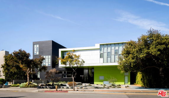 Front view of a modern two-story house with a bold architectural design.
