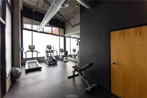 Fitness room with exercise machines and equipment.