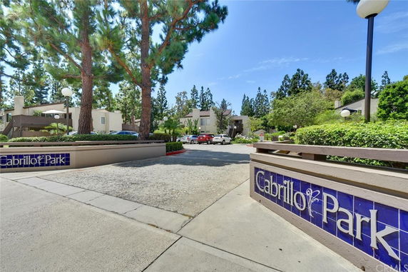 Front view of Cabrillo Park with residential buildings in the background.