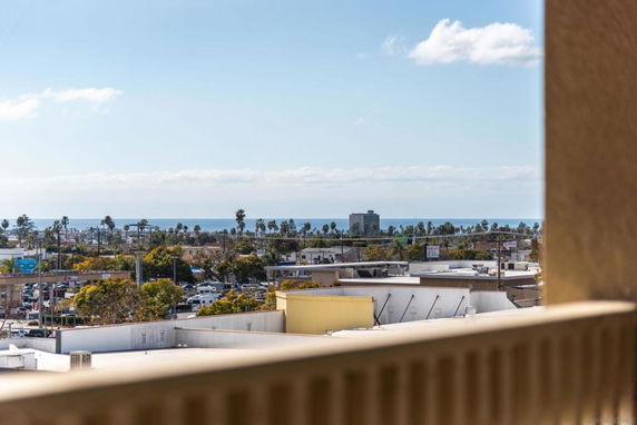 Panoramic view of cityscape with the ocean in the background.