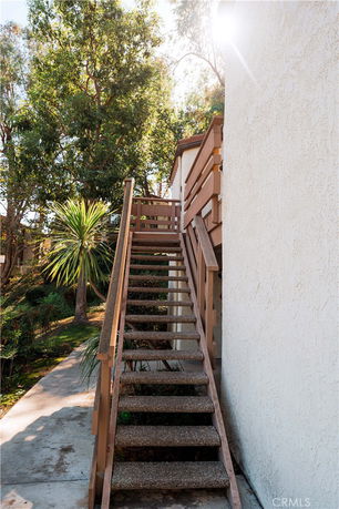 Exterior staircase leading to a raised entrance of a building.