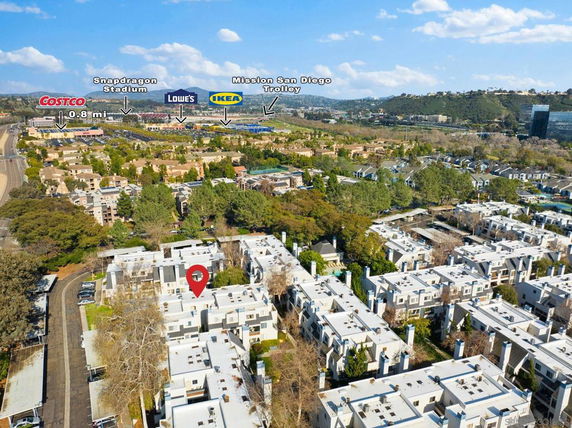 Aerial view of residential and commercial areas with labeled nearby landmarks.