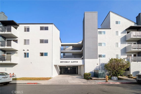 Front view of a multi-story apartment building named Beverly Lofts.