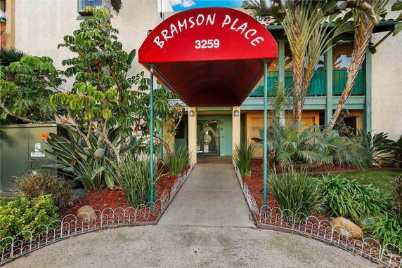 Front view of a building with a canopy entrance labeled Bramson Place 3259.