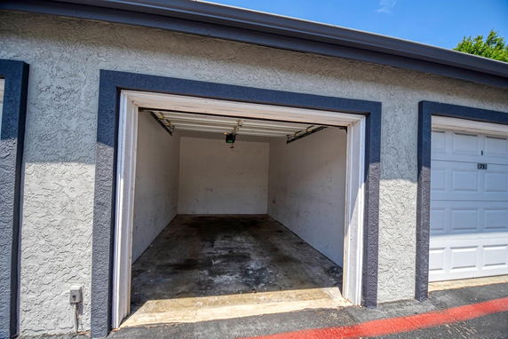 Open garage space with a single door.