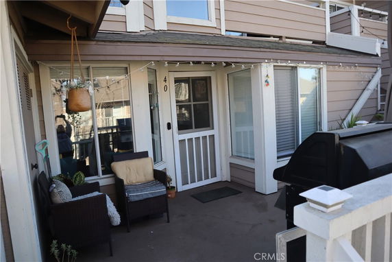 Front view of a house with a small patio area