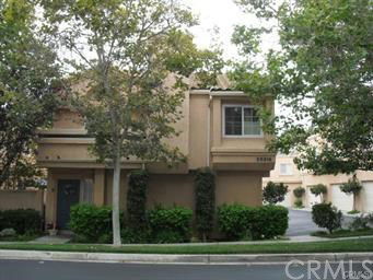 Front view of a two-story house with a beige exterior.