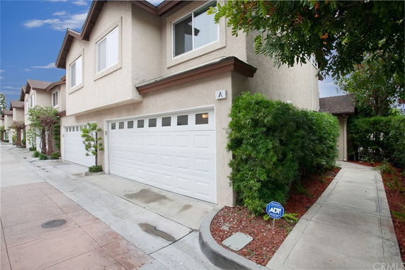 Front view of a two-story house with a double garage.