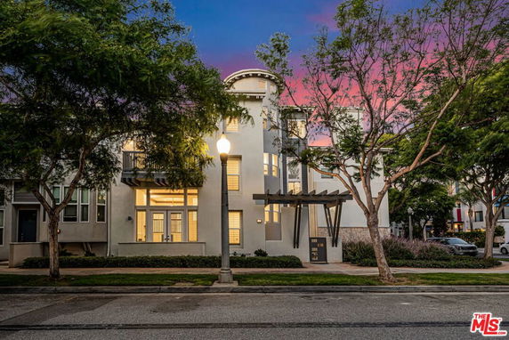 Front view of a multi-story building with a modern design.