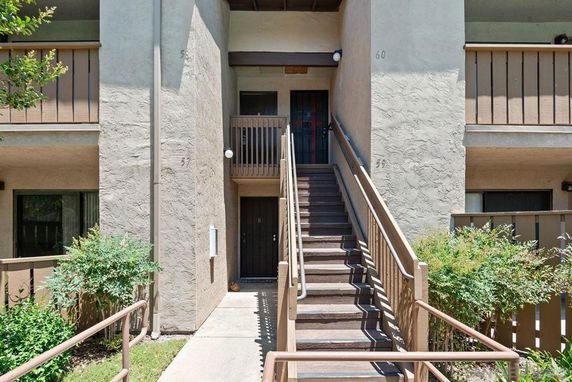 Front view of a multi-story building with stair access to upper levels.