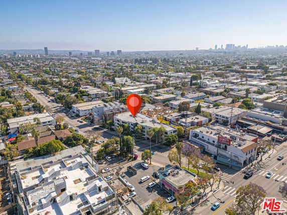 Panoramic view of a city with numerous buildings and streets.