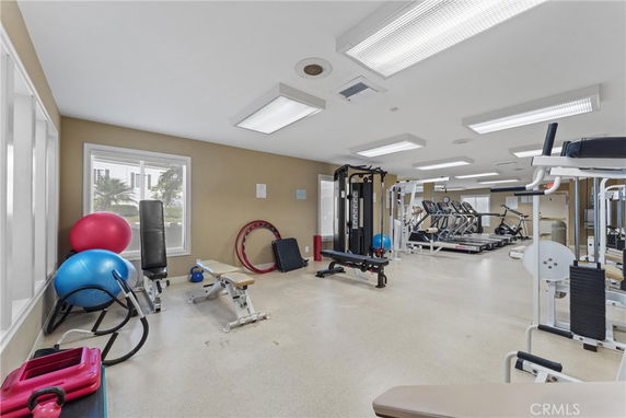 Indoor gym area with fitness equipment and exercise machines.