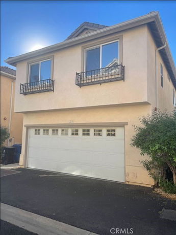Front view of a two-story house with a double garage.