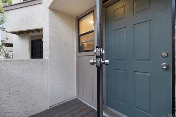 Front view of a house entrance with a blue door.