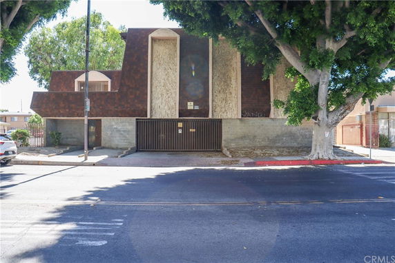 Front view of a multi-story building with a unique architectural design.