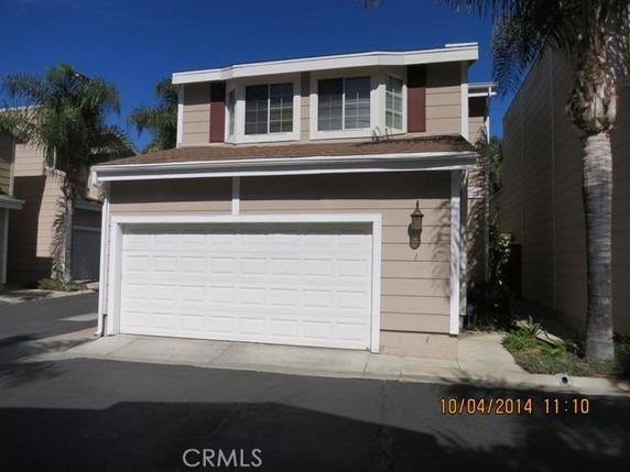 Front view of a two-story house with a double garage.