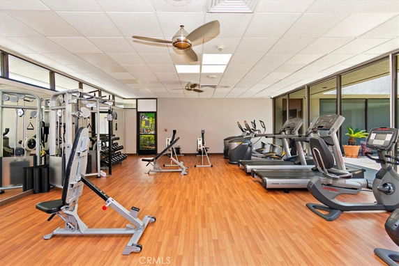 Indoor gym area with exercise machines and equipment.
