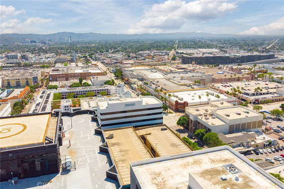 Wide panoramic view of an urban area with multiple buildings and streets.