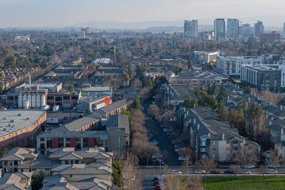 Panoramic view of an urban area with residential and commercial buildings.
