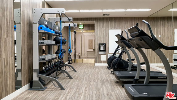 Indoor gym area with treadmills and exercise equipment.