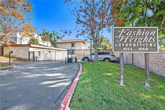 Front view of Fashion Heights Condominiums with gated entrance.