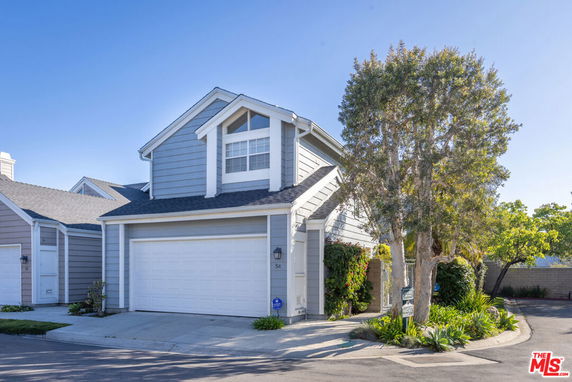 Front view of a two-story house with a garage.