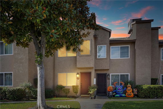 Front view of a two-story townhouse with Halloween decorations