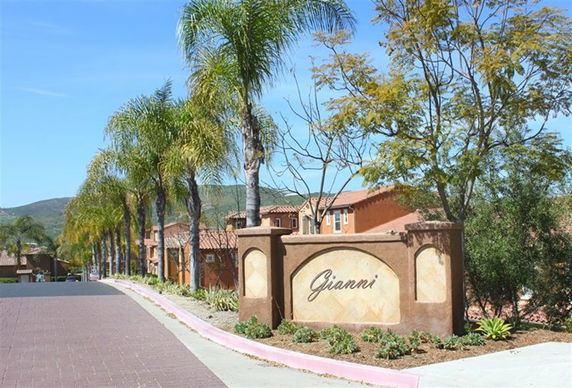 Front view of residential buildings with a sign marked 'Gianni'.