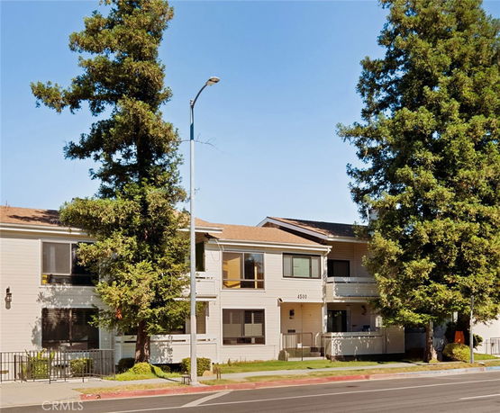 Front view of a two-story building with a beige exterior.